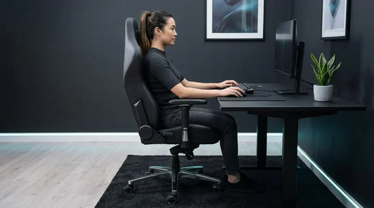 Side-view of a gamer in an ergonomic gaming chair, feet flat and upright posture — lumbar support for long sessions